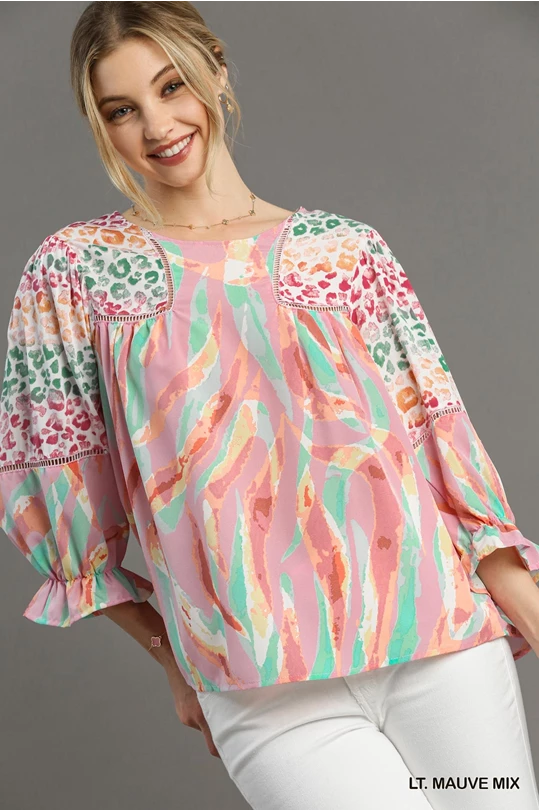 Umgee Mixed Print Top with 3/4 Sleeves and Lace Trim. Features Open Split Back Details with Button Closure